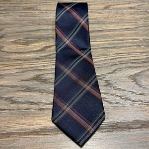 Izod 100% silk multi-colored plaid necktie. Blue background. Never worn